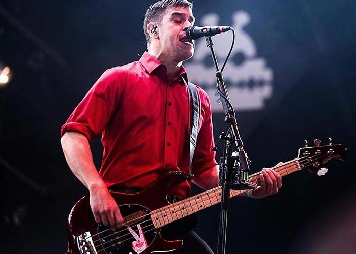 Jon Gallant of Billy Talent performing bass on stage in the Netherlands