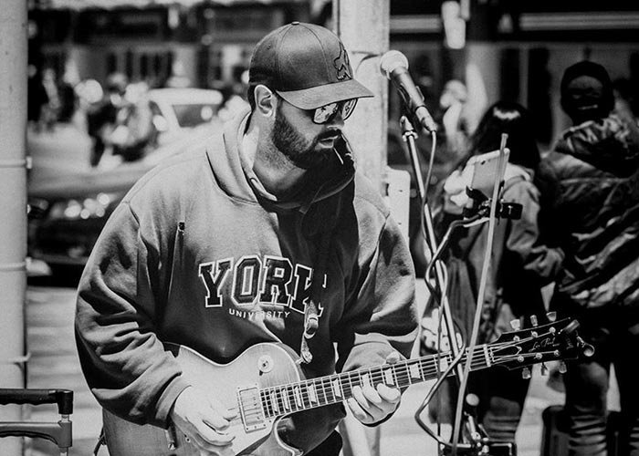 Michael Shanahan playing guitar, black-and-white photo
