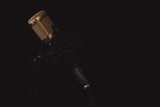 Studio microphone against a dark background